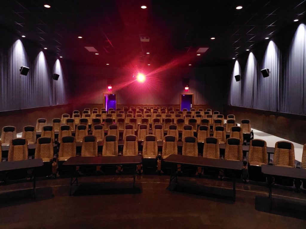 Mariner Theatre in Marinette Wisconsin. Locally Owned Movie Theater. View of the new luxury high back seats with tables in between each row, and 5 feet of space between the rows