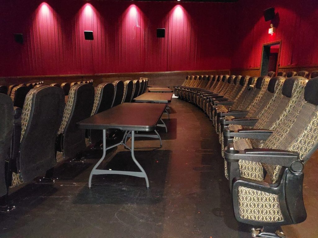 Mariner Theatre in Marinette Wisconsin. Locally Owned Movie Theater. View of the new luxury high back seats with tables in between each row. 5 feet of space between the rows